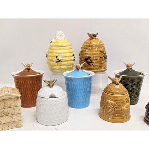 551 - A collection of porcelain honey pots. 14cm