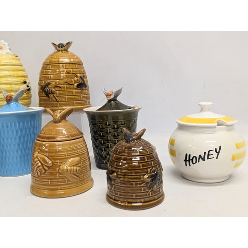 551 - A collection of porcelain honey pots. 14cm