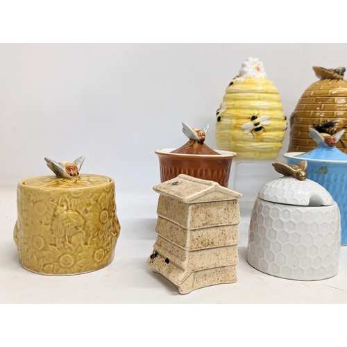 551 - A collection of porcelain honey pots. 14cm