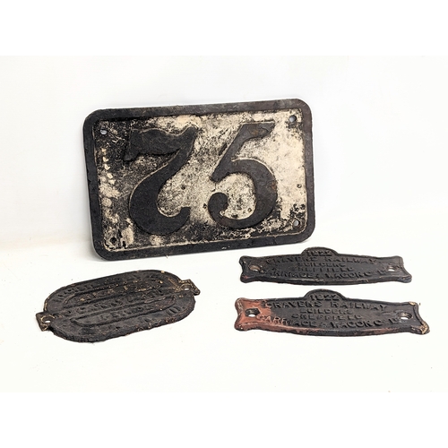 557 - A collection of early 20th century cast iron railway plaques. Dated 1916, 1922.