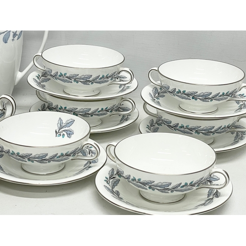 564 - A collection of Mintons coffee and dinner ware.