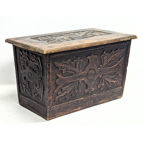 567 - A small vintage carved oak coffer. 65x37x39cm