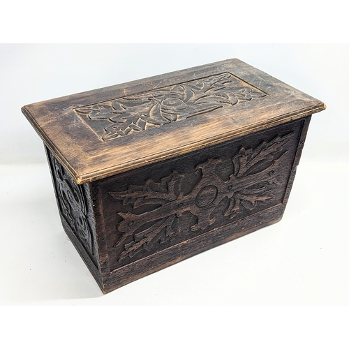 567 - A small vintage carved oak coffer. 65x37x39cm