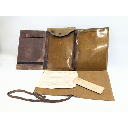 568 - A sundry lot containing a military map folder, field binoculars, military field first aid case, and ... 