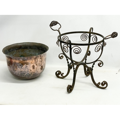 65A - A large late 19th century Art Nouveau copper planter in the original wrought iron base. 49x45x44cm