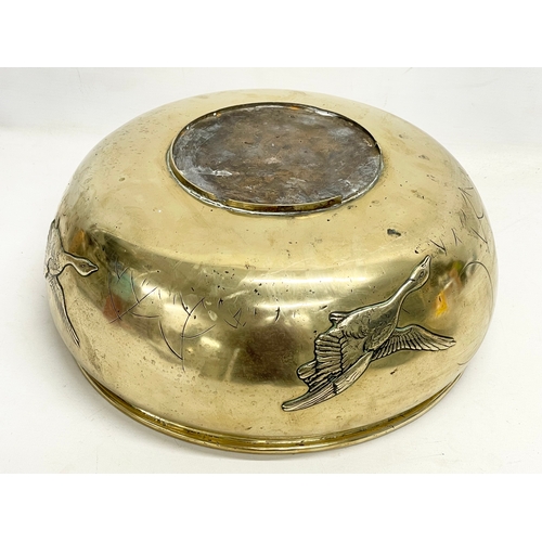 65B - A large late 19th century Japanese heavy brass bowl. 35x15cm