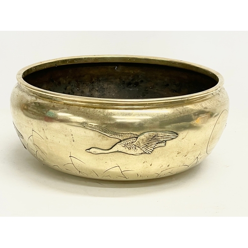 65B - A large late 19th century Japanese heavy brass bowl. 35x15cm