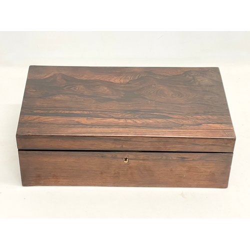 65C - A Victorian rosewood writing slope. Closed 43.5x25x14.5cm