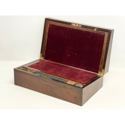 65C - A Victorian rosewood writing slope. Closed 43.5x25x14.5cm