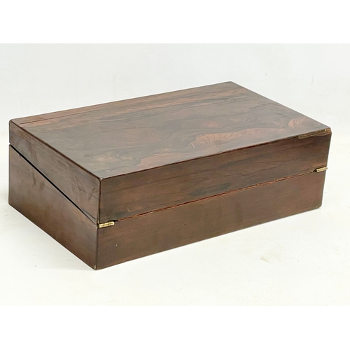 65C - A Victorian rosewood writing slope. Closed 43.5x25x14.5cm