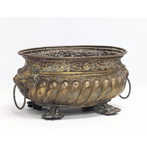 65E - An ornate 19th century planter with lion paw feet in the Regency style. 31x15.5cm