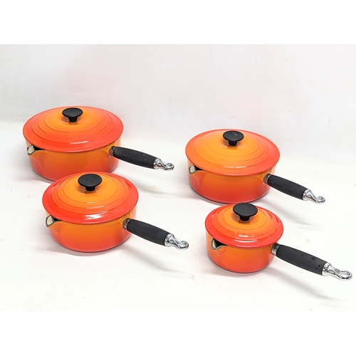 570 - A set of 4 cast iron Le Creuset pots. Largest measures 22x14cm without handle. Smallest measures 18x... 