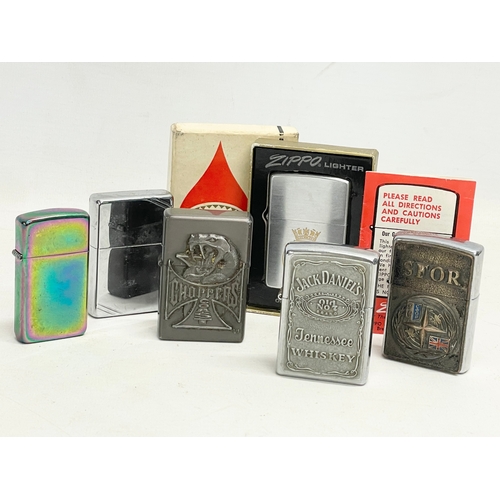 597 - A collection of Zippo lighters.