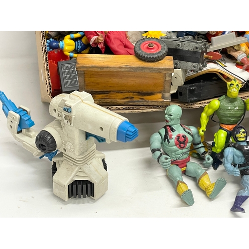 599 - A collection of vintage toys. Including He Man. Thundercats etc.