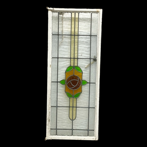 613 - A vintage stained glass panel. 48x119cm