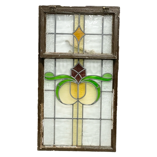 614 - A vintage stained glass panel. 51x92cm