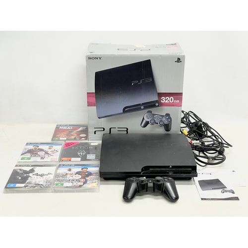 618 - A PlayStation 3 (PS3) in box with controller, leads and games.