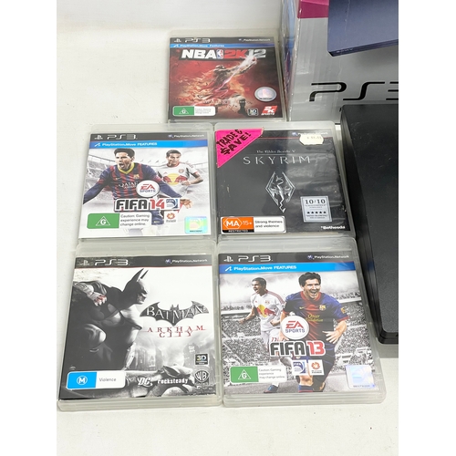 618 - A PlayStation 3 (PS3) in box with controller, leads and games.