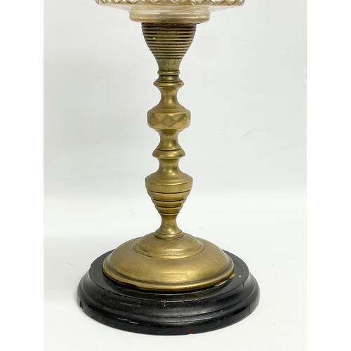 4 - A late Victorian double burner oil lamp with cut glass bowl and brass column. 57cm