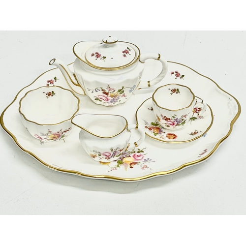 7 - A Royal Crown Derby ‘Derby Posies’ miniature porcelain tea set in box. Tray measures 22x17cm.