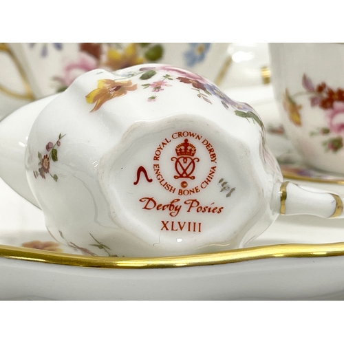 7 - A Royal Crown Derby ‘Derby Posies’ miniature porcelain tea set in box. Tray measures 22x17cm.