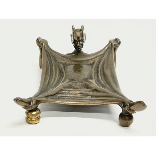 10 - A bronze ‘Devil Under A Sheet’ card tray. By Humphries, Jackson & Ambler LTD. Early 20th century. Ma... 