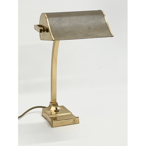 11 - A large good quality brass desk lamp with leather shade. 22x29x40.5cm