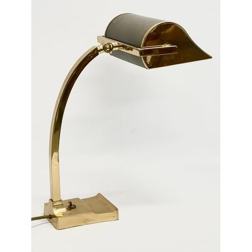 11 - A large good quality brass desk lamp with leather shade. 22x29x40.5cm