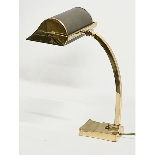 11 - A large good quality brass desk lamp with leather shade. 22x29x40.5cm