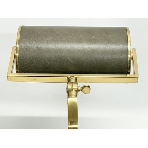 11 - A large good quality brass desk lamp with leather shade. 22x29x40.5cm