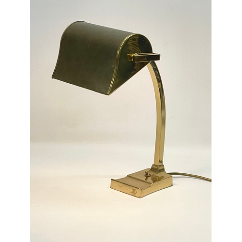 11 - A large good quality brass desk lamp with leather shade. 22x29x40.5cm