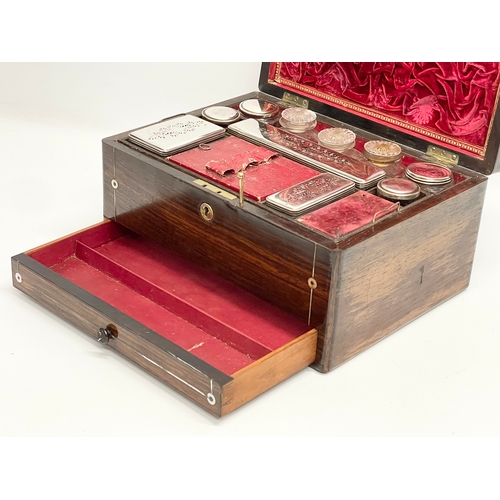 16 - A Victorian rosewood vanity box with Mother of Pearl inlay and cut glass bottles with silver plated ... 