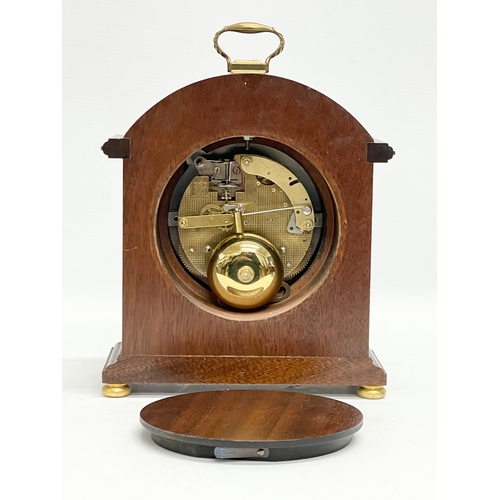 19 - A Comitti of London inlaid mahogany mantle clock. With key. 18x8.5x24cm