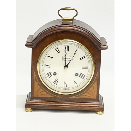 19 - A Comitti of London inlaid mahogany mantle clock. With key. 18x8.5x24cm