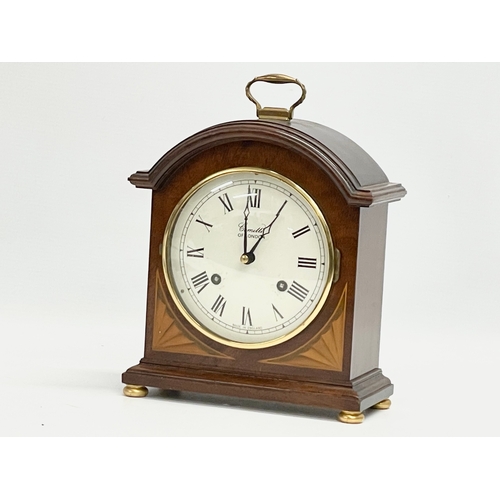 19 - A Comitti of London inlaid mahogany mantle clock. With key. 18x8.5x24cm