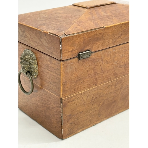 46 - A Regency oak tea caddy. Circa 1810.  21x11x14cm