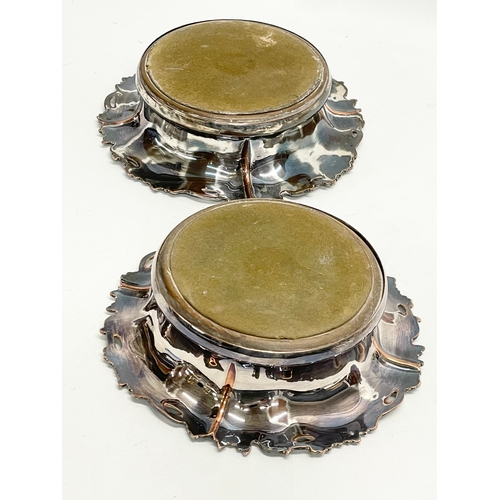 222 - A pair of large Victorian silver plated wine coasters. 19cm