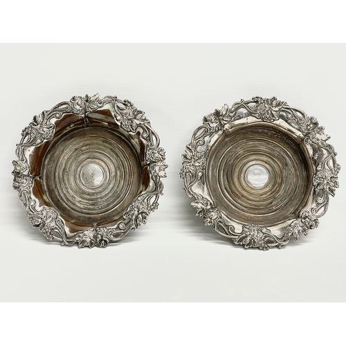 222 - A pair of large Victorian silver plated wine coasters. 19cm