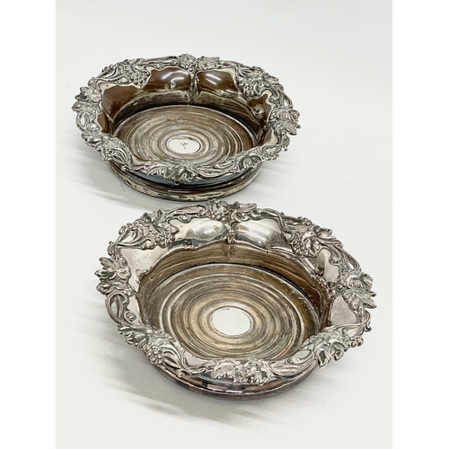 222 - A pair of large Victorian silver plated wine coasters. 19cm