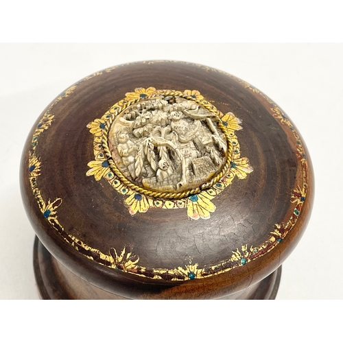 48 - A late 19th/early 20th century lidded padauk treen with finely carved bone and hand painted gilding.... 