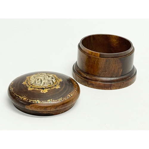 48 - A late 19th/early 20th century lidded padauk treen with finely carved bone and hand painted gilding.... 