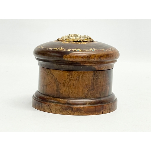 48 - A late 19th/early 20th century lidded padauk treen with finely carved bone and hand painted gilding.... 