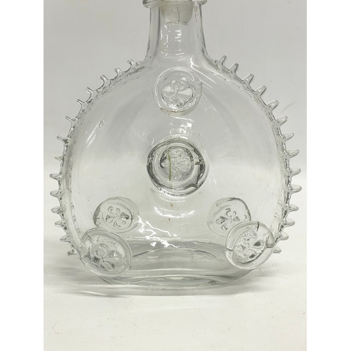 24 - A pair of Remi Martin Baccarat Glass cognac decanters. 16x28cm