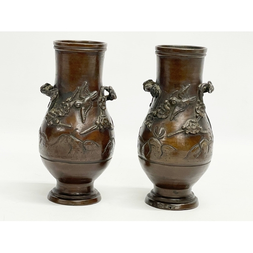 73 - A pair of late 19th century Japanese bronze vases. 20cm