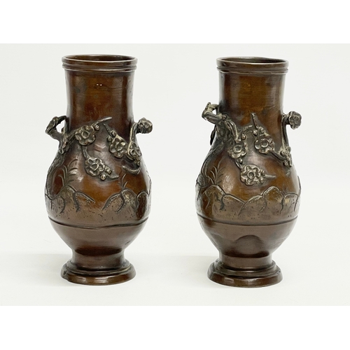 73 - A pair of late 19th century Japanese bronze vases. 20cm