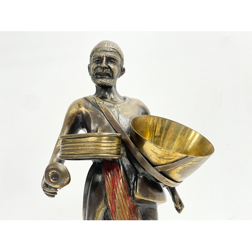 75 - A large bronze Middle Eastern figure on marble base. 20x34.5cm