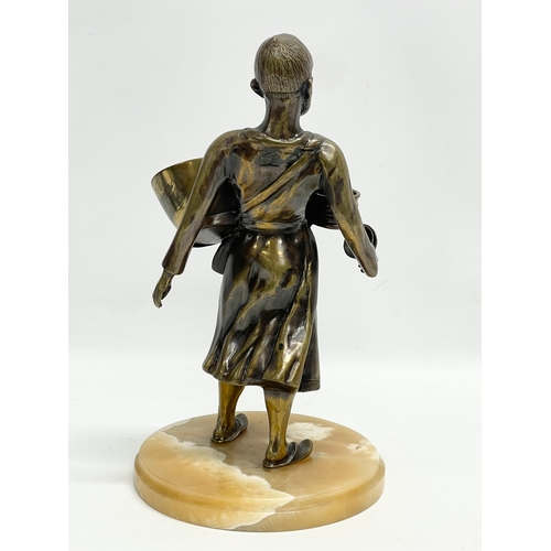 75 - A large bronze Middle Eastern figure on marble base. 20x34.5cm