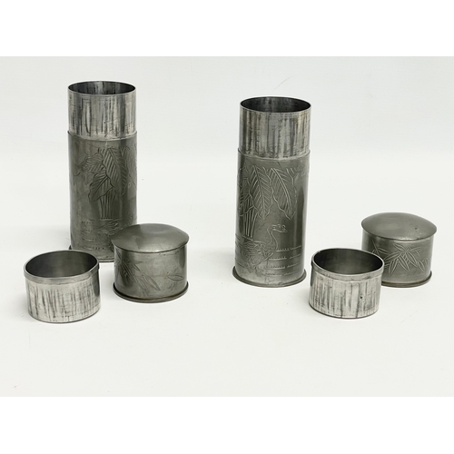 76 - A pair of late 19th century Chinese pewter canisters. 16cm