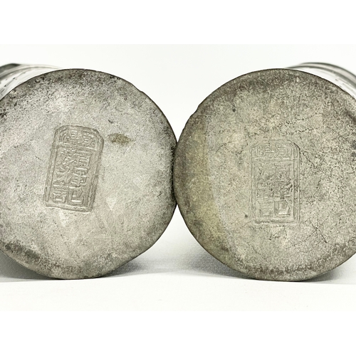 76 - A pair of late 19th century Chinese pewter canisters. 16cm