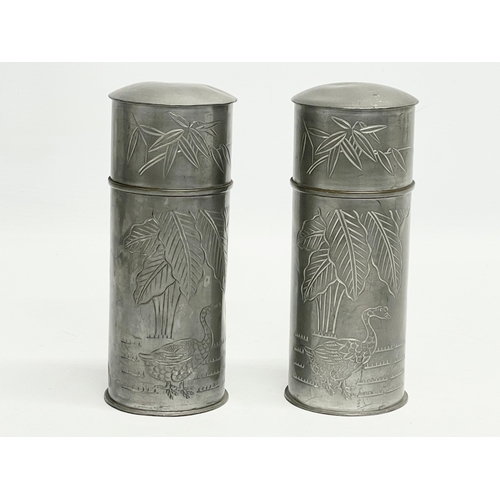 76 - A pair of late 19th century Chinese pewter canisters. 16cm